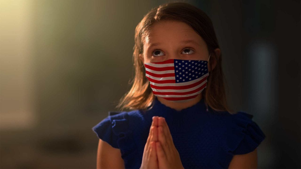 Girl prays with mask pic